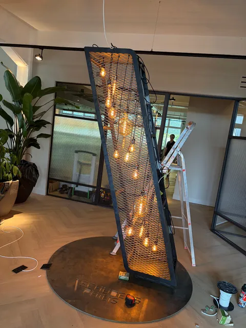 The slash light sculpture over the Schuberg Philis steel plate